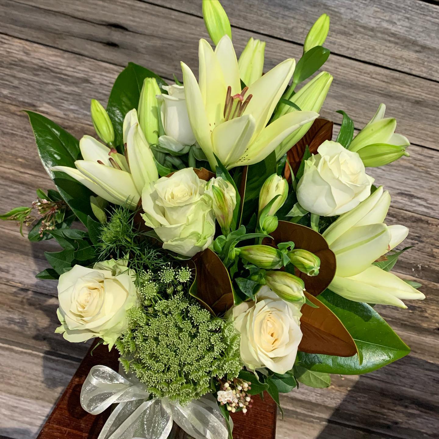 
                  
                    Bouquet of white flowers with greenery 
                  
                